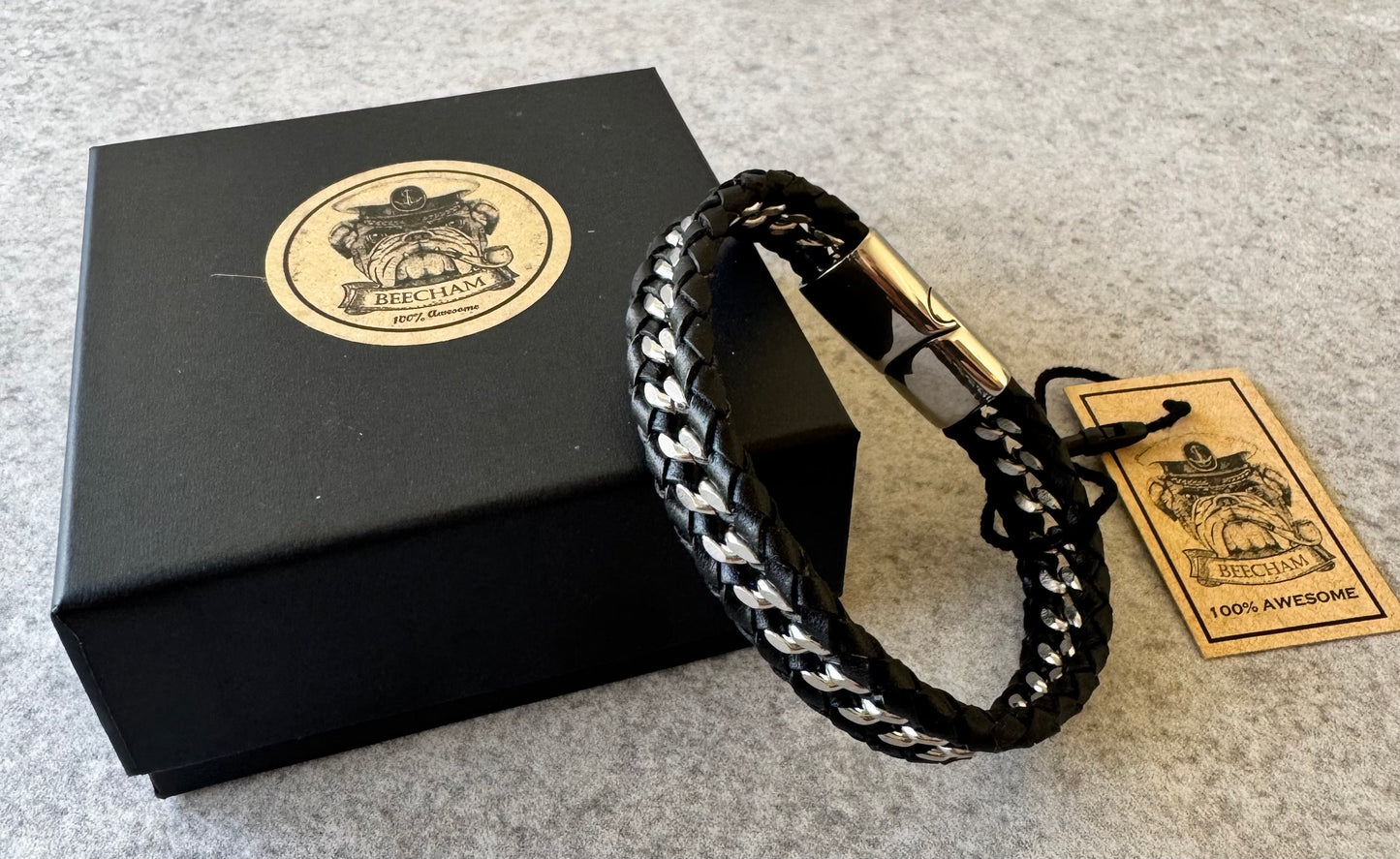 A braided leather bracelet with a stainless steel magnetic clasp. This bracelet comes in a Beecham gift box brought to you by kenny k. 