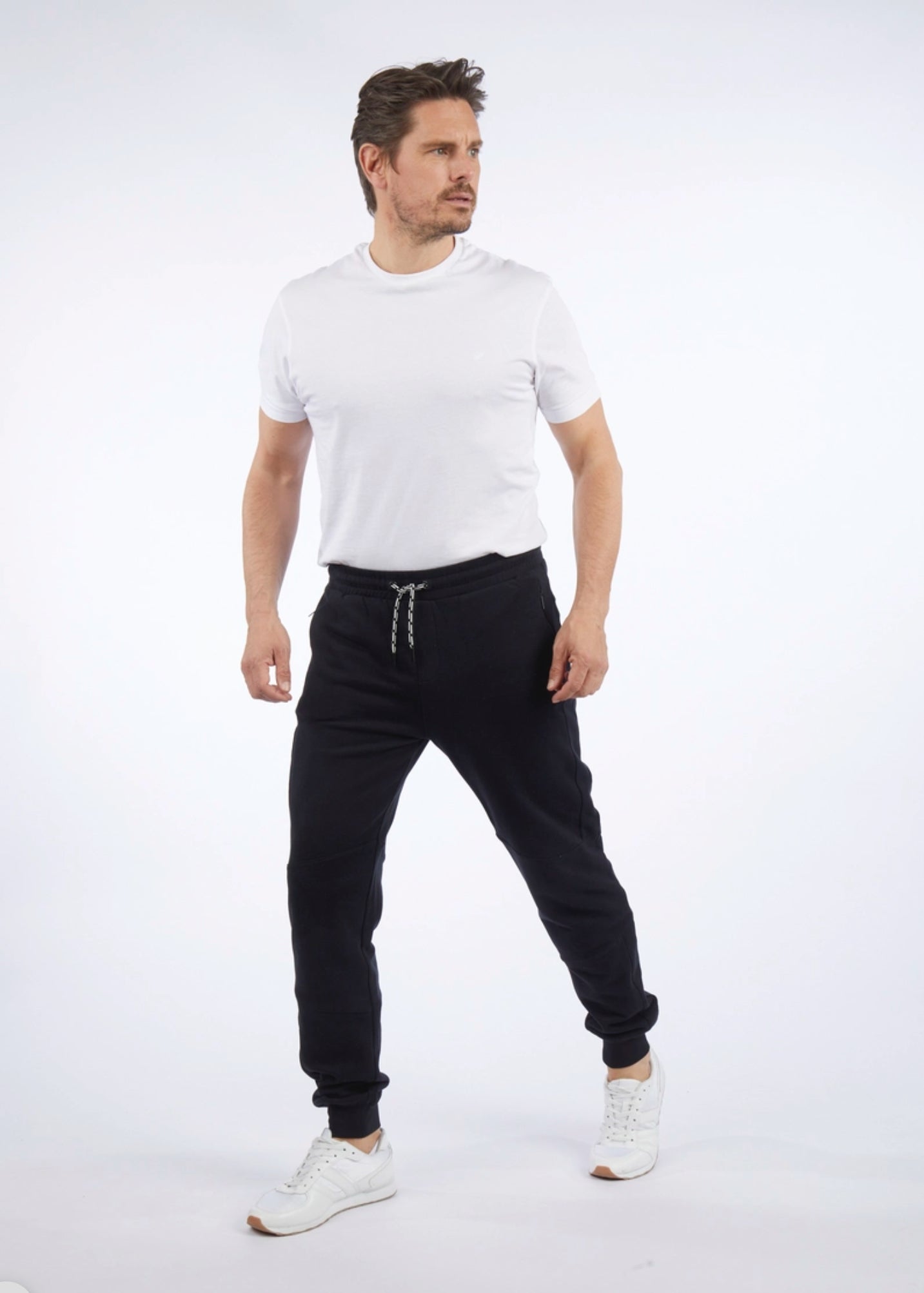 The perfect blend of casual comfort and sharp styling, the Daniel Hechter track pants are a go-to for relaxed days without sacrificing polish. Pair with the matching hoody or dress up with a crisp kennyk. tee and sneakers for elevated street style.
Tapered fit with ribbed ankle cuffs for a streamlined silhouette
Elastic waistband with adjustable drawcord for a personalised fit
Side pockets plus a discreet rear welt pocket for everyday essentials
Finished with a tonal Daniel Hechter logo for a clean modern