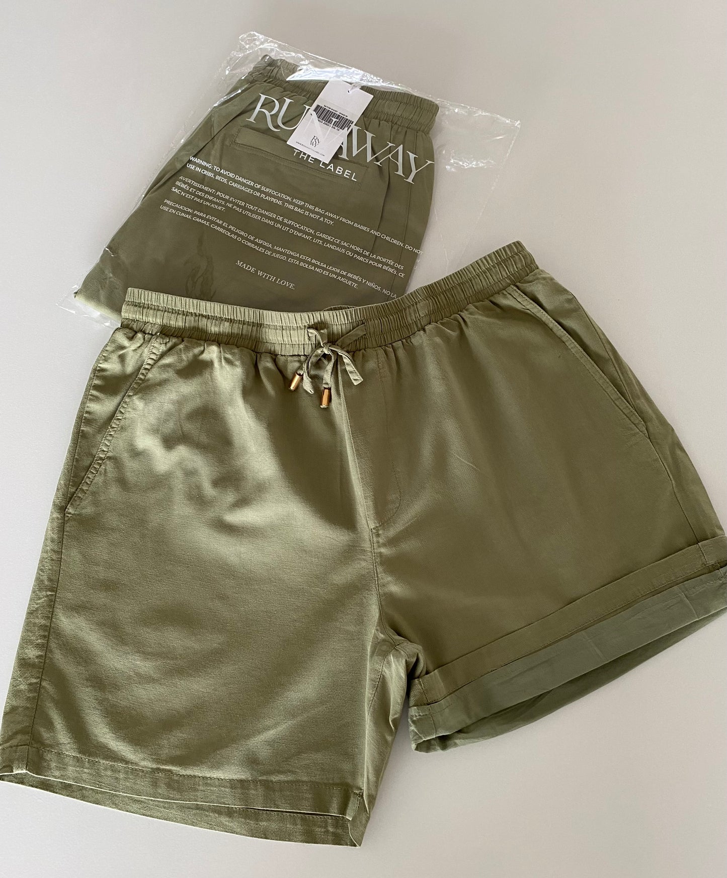 Elevate your style with the Irotas Leisure Short by RUNAWAY & kenny k. This classic short is the perfect addition to any wardrobe, effortlessly combining comfort and style. Pair it with the matching kenny k. t-shirt for a complete and stylish look.
- Relaxed fit
- Elasticated waistband and drawstring
- Side and back pockets
- Lined with no stretch
- 100% Cotton
Please refer to care label for garment care instructions.