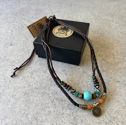 Crafted with premium leather and adorned with carefully selected beads, the Beecham Necklace brought to you by kenny k. embodies coastal elegance. This versatile accessory effortlessly elevates casual outfits with its relaxed, beachy aesthetic while maintaining a sophisticated edge. Perfect for layering or wearing as a statement piece for your sun-soaked adventures.&nbsp;