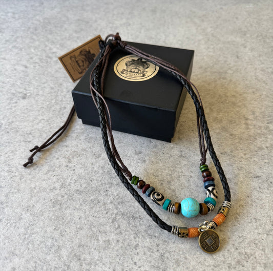 Crafted with premium leather and adorned with carefully selected beads, the Beecham Necklace brought to you by kenny k. embodies coastal elegance. This versatile accessory effortlessly elevates casual outfits with its relaxed, beachy aesthetic while maintaining a sophisticated edge. Perfect for layering or wearing as a statement piece for your sun-soaked adventures.&nbsp;