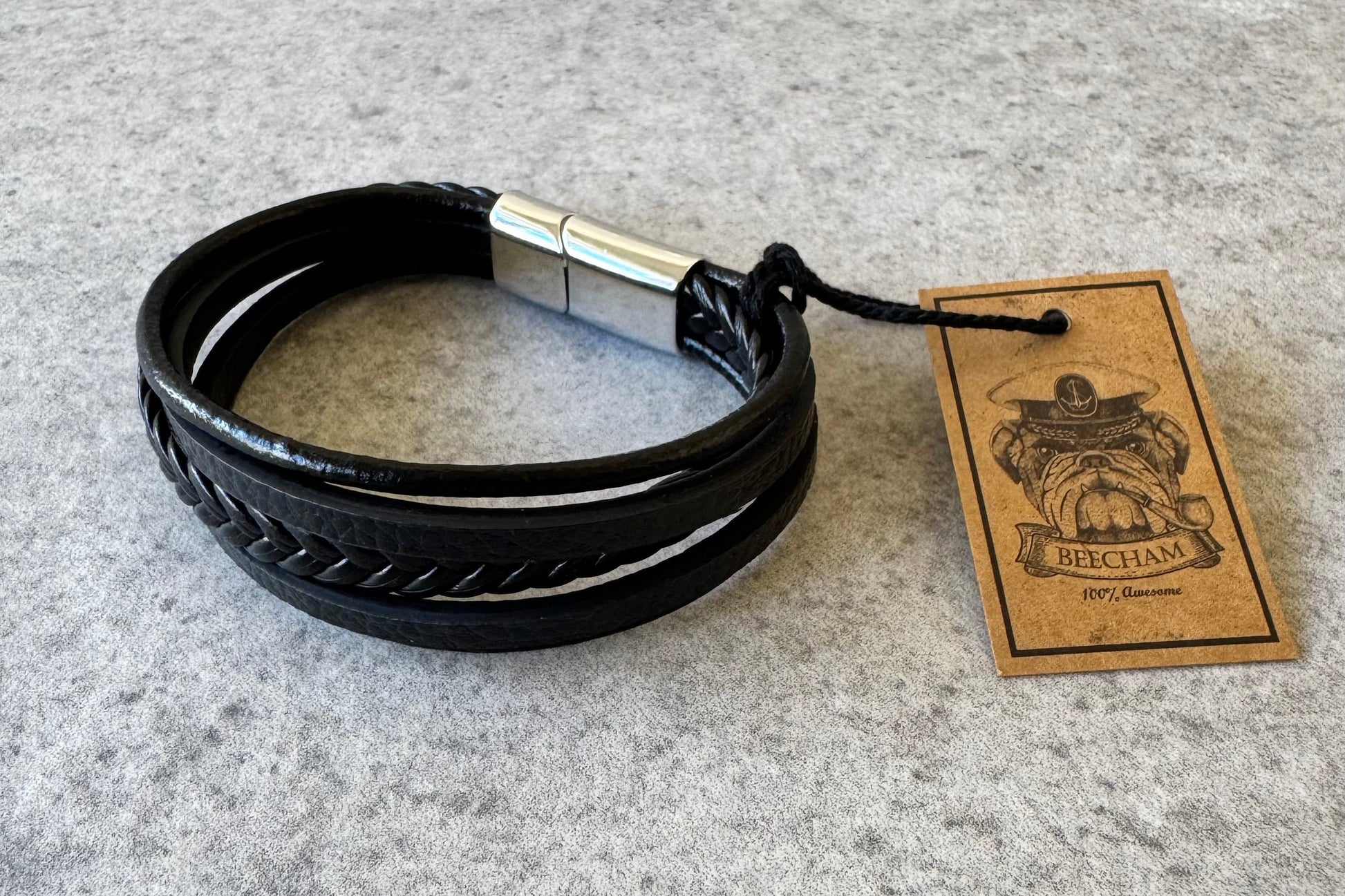 rafted with premium black leather, the Beecham bracelet combines sophisticated style with everyday wearability. The elegant silver clip closure ensures a secure fit while maintaining a refined aesthetic. This men's accessory is completely lead and nickel free, making it suitable for sensitive skin and all-day comfort. Brought to you by kenny k.&nbsp;