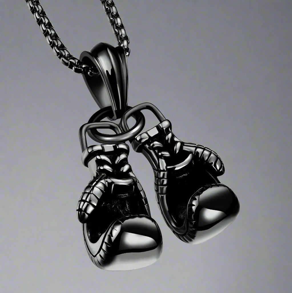 For the sporting man. A black chain with a pair of boxing gloves. In a Beecham gift box brought to you by kenny k.&nbsp;