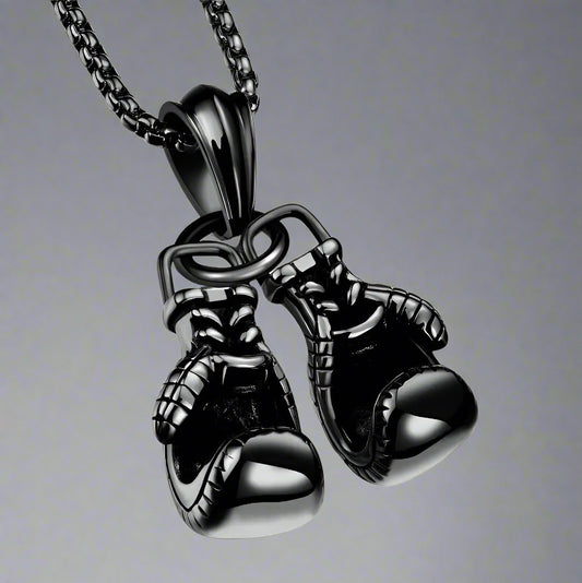 For the sporting man. A black chain with a pair of boxing gloves. In a Beecham gift box brought to you by kenny k.&nbsp;
