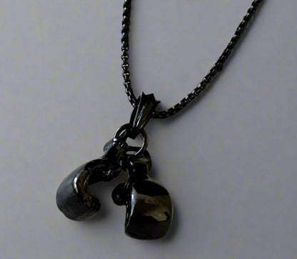 For the sporting man. A black chain with a pair of boxing gloves. In a Beecham gift box brought to you by kenny k.&nbsp;
