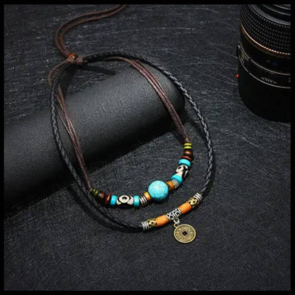 Crafted with premium leather and adorned with carefully selected beads, the Beecham Necklace brought to you by kenny k. embodies coastal elegance. This versatile accessory effortlessly elevates casual outfits with its relaxed, beachy aesthetic while maintaining a sophisticated edge. Perfect for layering or wearing as a statement piece for your sun-soaked adventures.&nbsp;
