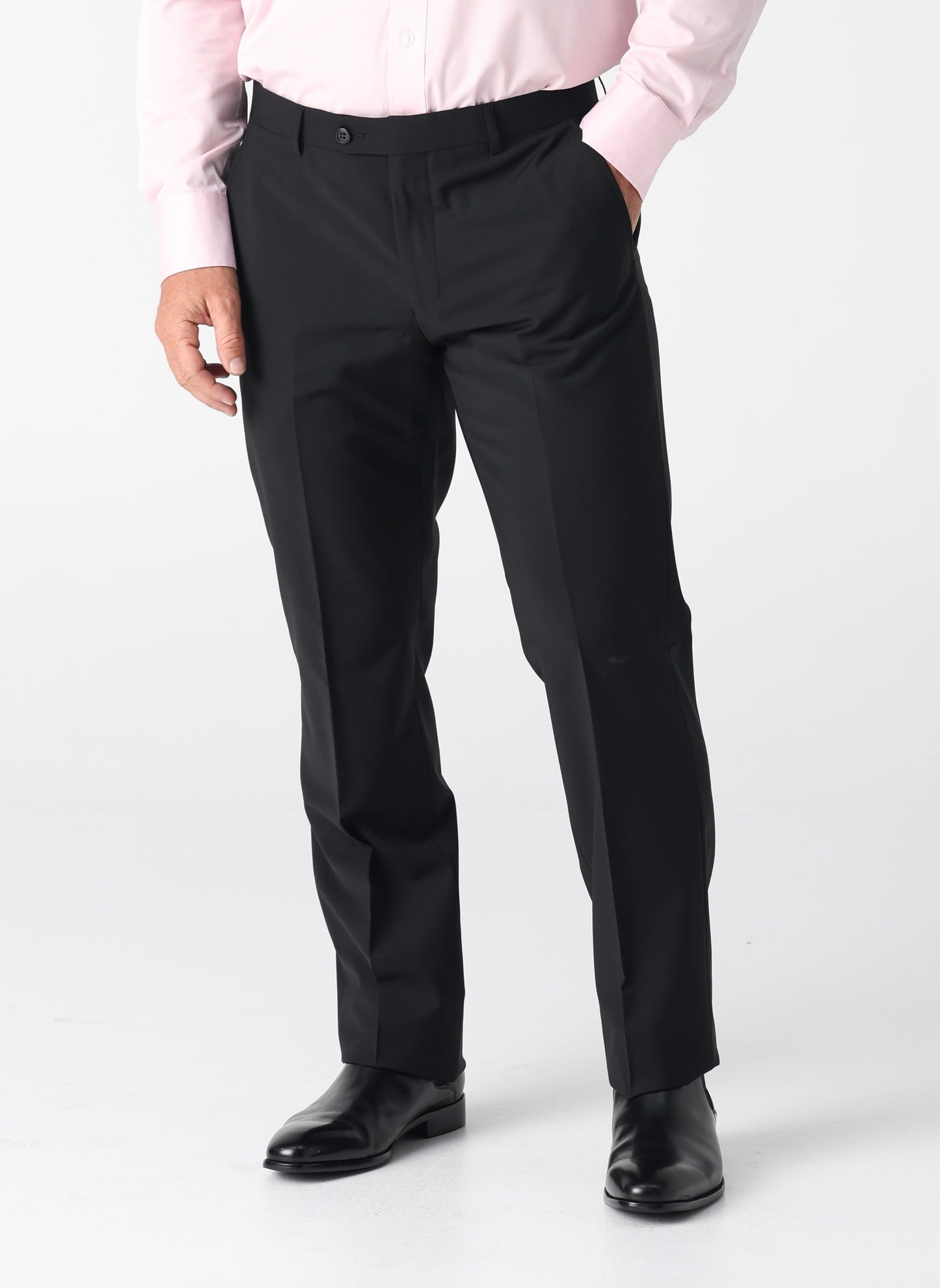 Crafted from a balanced 50% wool and 50% polyester blend, the Bendigo Trouser delivers professional polish with everyday practicality. The wool provides natural structure and breathability, while polyester adds durability and easy care—machine washable without compromise. In classic black, these trousers are the ultimate office essential. Pair them with any shirt, from crisp whites to bold patterns, and transition seamlessly from desk to dinner. The refined cut ensures a sharp silhouette that works across s