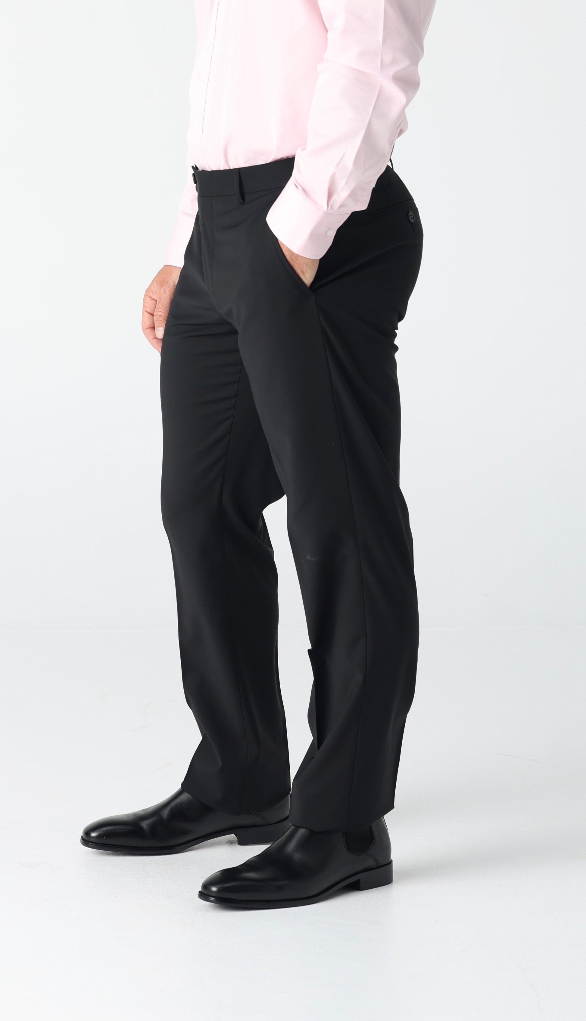 Crafted from a balanced 50% wool and 50% polyester blend, the Bendigo Trouser delivers professional polish with everyday practicality. The wool provides natural structure and breathability, while polyester adds durability and easy care—machine washable without compromise. In classic black, these trousers are the ultimate office essential. Pair them with any shirt, from crisp whites to bold patterns, and transition seamlessly from desk to dinner. The refined cut ensures a sharp silhouette that works across s