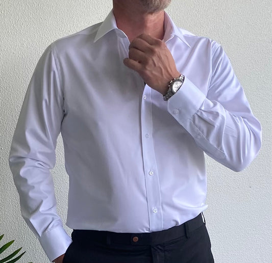 Experience the perfect combination of style and comfort with the Boston Slim Fit Business Shirt brought to you by kenny k. Made from a blend of cotton and polyester, this classic shirt is designed to offer a sleek and professional look while keeping you cool and comfortable all day. Expertly crafted to complement your business attire, it is a must-have for any wardrobe.&nbsp;
