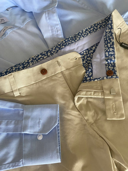 The relaxed Chino by Boston Fine Tailoring.&nbsp;Transform from the perfect work look to an easy smart casual look in a minute. These Chinos are crafted from comfort stretch fabric for a chill and comfortable fit. Step up your style game with this modern, sophisticated piece.

97% Cotton
3% Spandex
Machine Washable
Brought to you by kenny k.