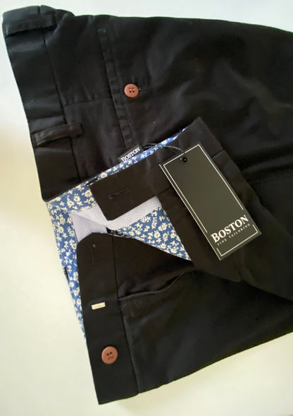 The relaxed Chino by Boston Fine Tailoring.&nbsp;Transform from the perfect work look to an easy smart casual look in a minute. These Chinos are crafted from comfort stretch fabric for a chill and comfortable fit. Step up your style game with this modern, sophisticated piece.

97% Cotton
3% Spandex
Machine Washable
Brought to you by kenny k.