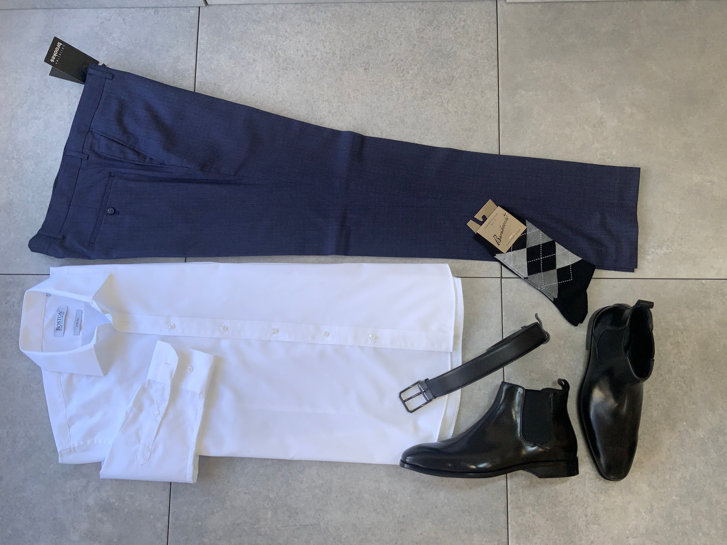 The Christian Brooks Cam Suite Trouser brought to you by kenny k. offers timeless style with a sharp, modern edge. Cut in a slim, tailored fit, these trousers are the ideal foundation for men's formalwear, whether you're dressing for the office, an event, or a refined everyday look. Crafted from a premium polyester/viscose/elastane blend, they offer a polished drape with just enough stretch for day long comfort.&nbsp;

65% Polyester, 33% Viscose, 2% Elastane
Durable, wrinkle resistant and breathable with a 