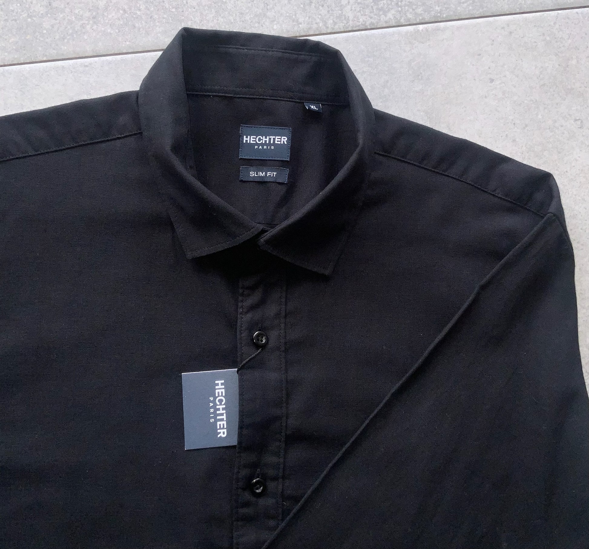 Designed with a tailored slim fit, the Daniel Hechter Slim Fit Linen shirt offers &nbsp;a sharp, contemporary silhouette that pairs seamlessly with chinos, jeans or tailored trousers. The classic black hue adds versatility and timeless appeal, making it a go to for casual, business, evening events or effortless smart weekend looks. This shirt is lightweight, naturally cooling and ideal for warmer days.

Slim fit for a modern, flattering profile
55% Linen, 45% Cotton
Classic button up front with a structured