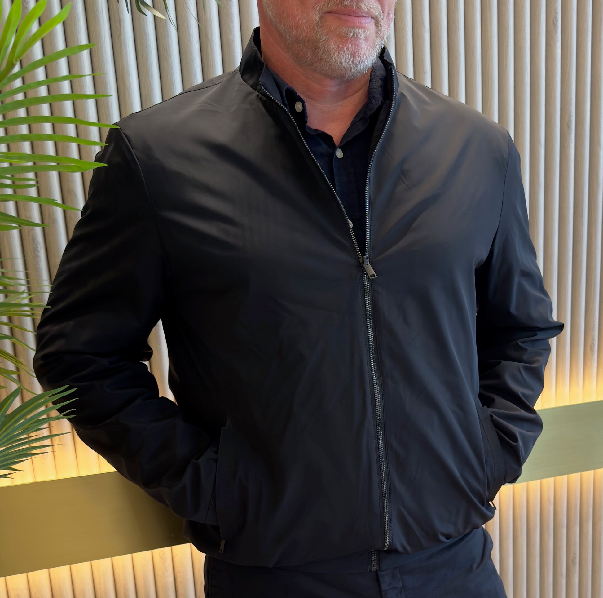 The Daniel Hechter Bomber Jacket is a harmonious blend of sleek urban style and practical function. It’s minimalist design and premium finishing details like the zip security pockets and ribbed trims, elevate it above typical casual wear. It transitions seamlessly from day outings to evening gatherings without fuss.

100% polyester with matching polyester lining, offering lightweight structure and easy care durability
Full length front zip, reinforced with quality stitching for durability
Practical zippered