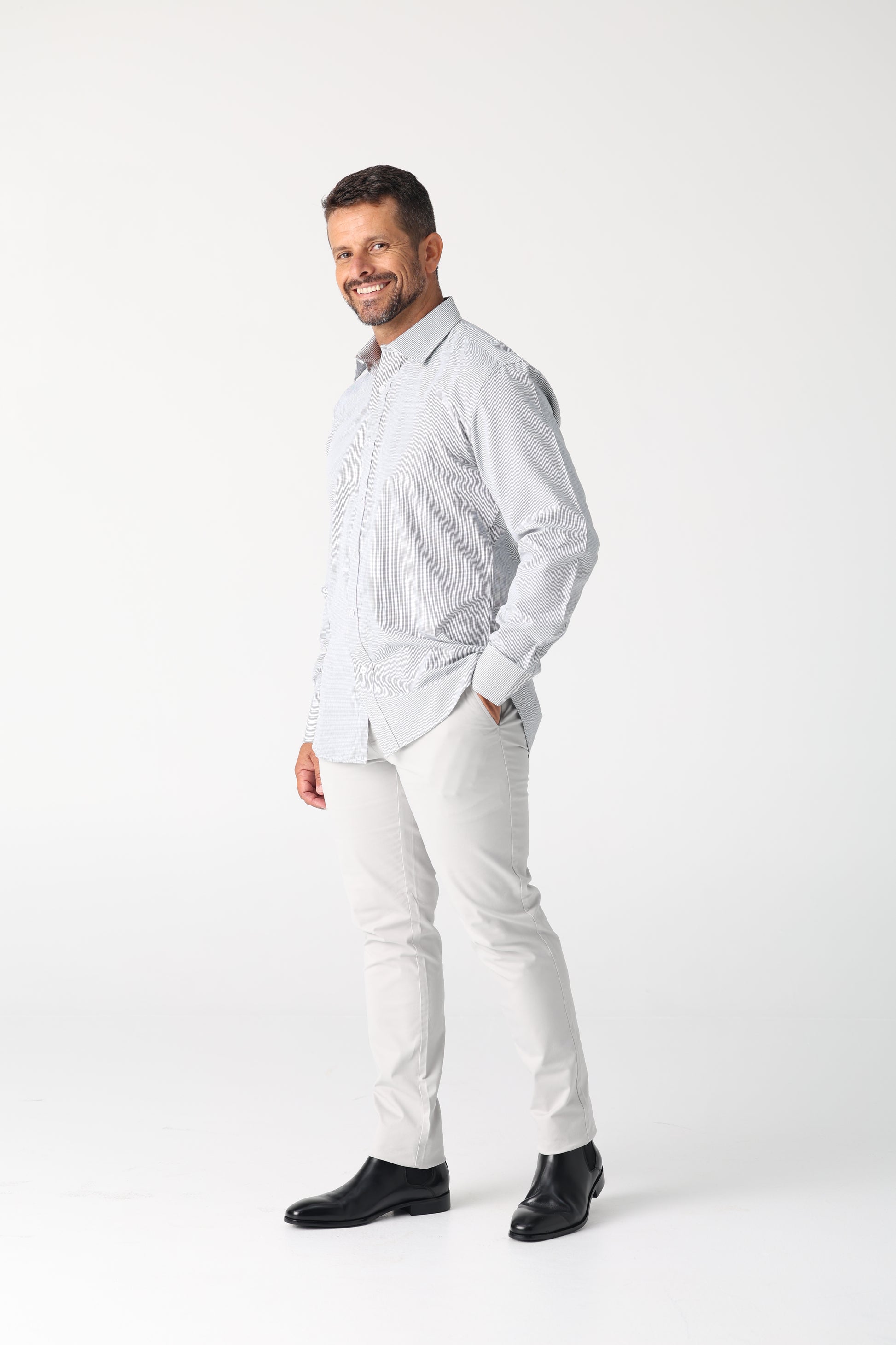 Classic style meets modern tailoring with Liberty black and white check business shirt. Designed for versatility and comfort, this shirt features a crisp check pattern that transitions effortlessly form the boardroom to after hours. Crafted from a breathable cotton/polyester blend, it delivers all day wearability with a polished, professional finish. The structured collar and button up design make it ideal for pairing with tailored trousers, chinos or layered under a blazer.

Black and White check pattern f