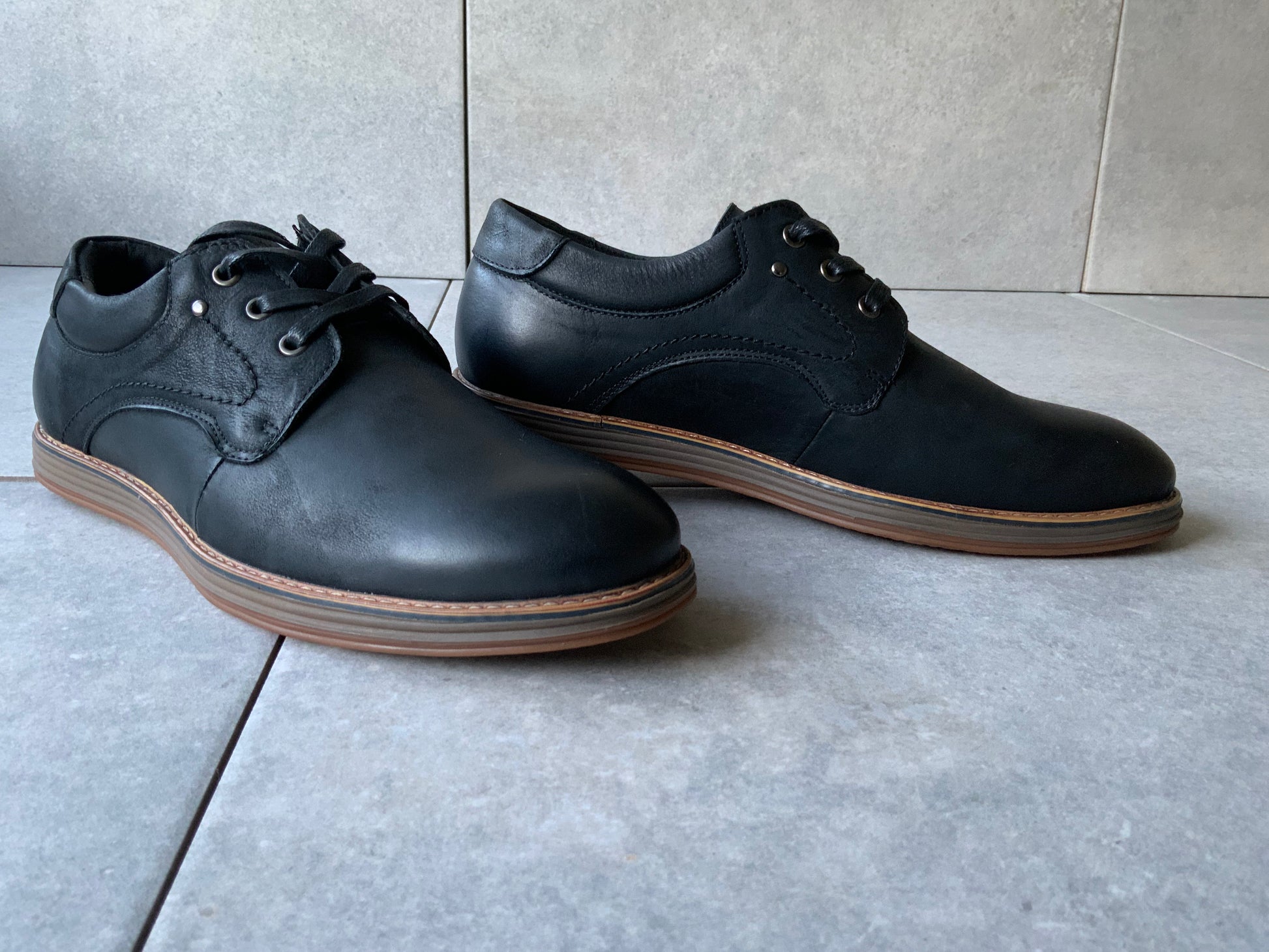 Command attention in the boardroom or at your next formal event with the Massa Maverick Dress Shoe, where classic design meets modern edge. Crafted with a premium polished leather upper, this lace up dress shoe features a sleek almond toe, clean stitching detail and a slim, refined silhouette for a sophisticated finish. The cushioned inner sole delivers comfort from day to night, while the durable rubber outsole provides grip and stability with every step.