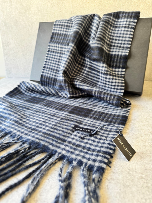 Elevate your style with Park Avenue Scarves brought to you by kenny k. These stylish scarves are made from 100% recycled polyester, keeping you warm and environmentally conscious. Featuring a classy fringe and a generous 180cm length, they are the perfect addition to any outfit. Stay fashionably cosy and eco-friendly with Park Avenue Scarves.