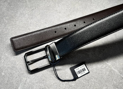 Complete your outfit with this must-have Parker Avenue men’s reversible leather belt, brought to you by kennyk. The perfect blend of style, function and versatility. Crafted from durable synthetic leather with a polished finish this two-in-one dress belt adds a sophisticated touch to any look.

Sleek rotating buckle for easy colour change from black to brown or black to grey to match your shoes
Stylish and durable synthetic leather construction
Classic polished metal hardware