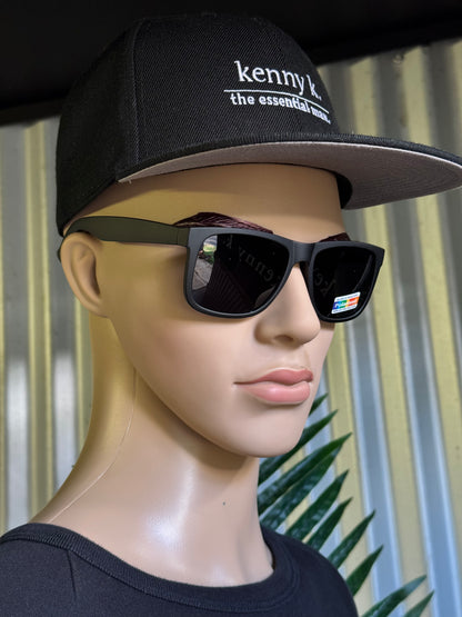 Mannequin head wearing a black cap with 'kenny k' branding and sunglasses. Wayfarer Style. 