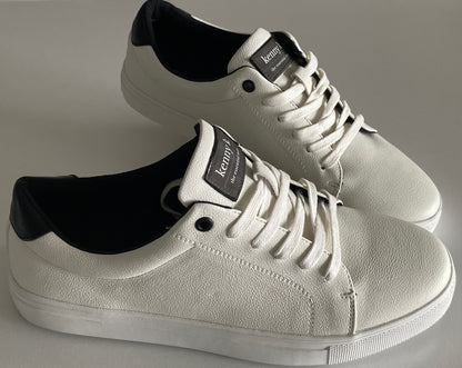 Introducing the essential white sneaker by Connor &amp; Kenny K. Made from high-quality faux leather, these sneakers are stylish and a basic essential for business and leisure. With their classic white design, they are perfect for any outfit and any occasion. Upgrade your footwear game with these must-have sneakers.