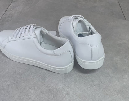 Crafted with premium leather inside and out, the Classic Calmino Leather sneaker delivers exceptional durability and comfort. The timeless white design offers versatile styling options while the quality construction ensures proper foot support and breathability. These sneakers combine traditional craftsmanship with everyday wearability for discerning footwear enthusiasts.