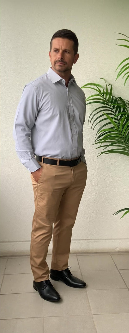 Classic style meets modern tailoring with Liberty black and white check business shirt. Designed for versatility and comfort, this shirt features a crisp check pattern that transitions effortlessly form the boardroom to after hours. Crafted from a breathable cotton/polyester blend, it delivers all day wearability with a polished, professional finish. The structured collar and button up design make it ideal for pairing with tailored trousers, chinos or layered under a blazer.